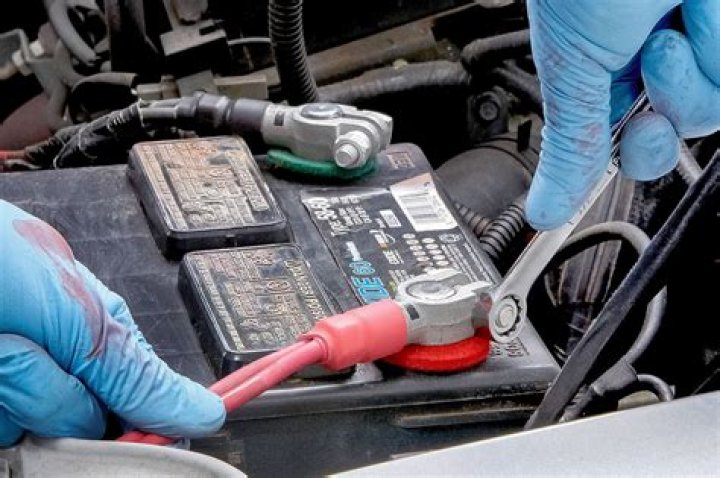 How do you remove rust from car battery terminals?