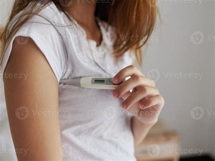 How long do you leave a disposable thermometer under the arm?